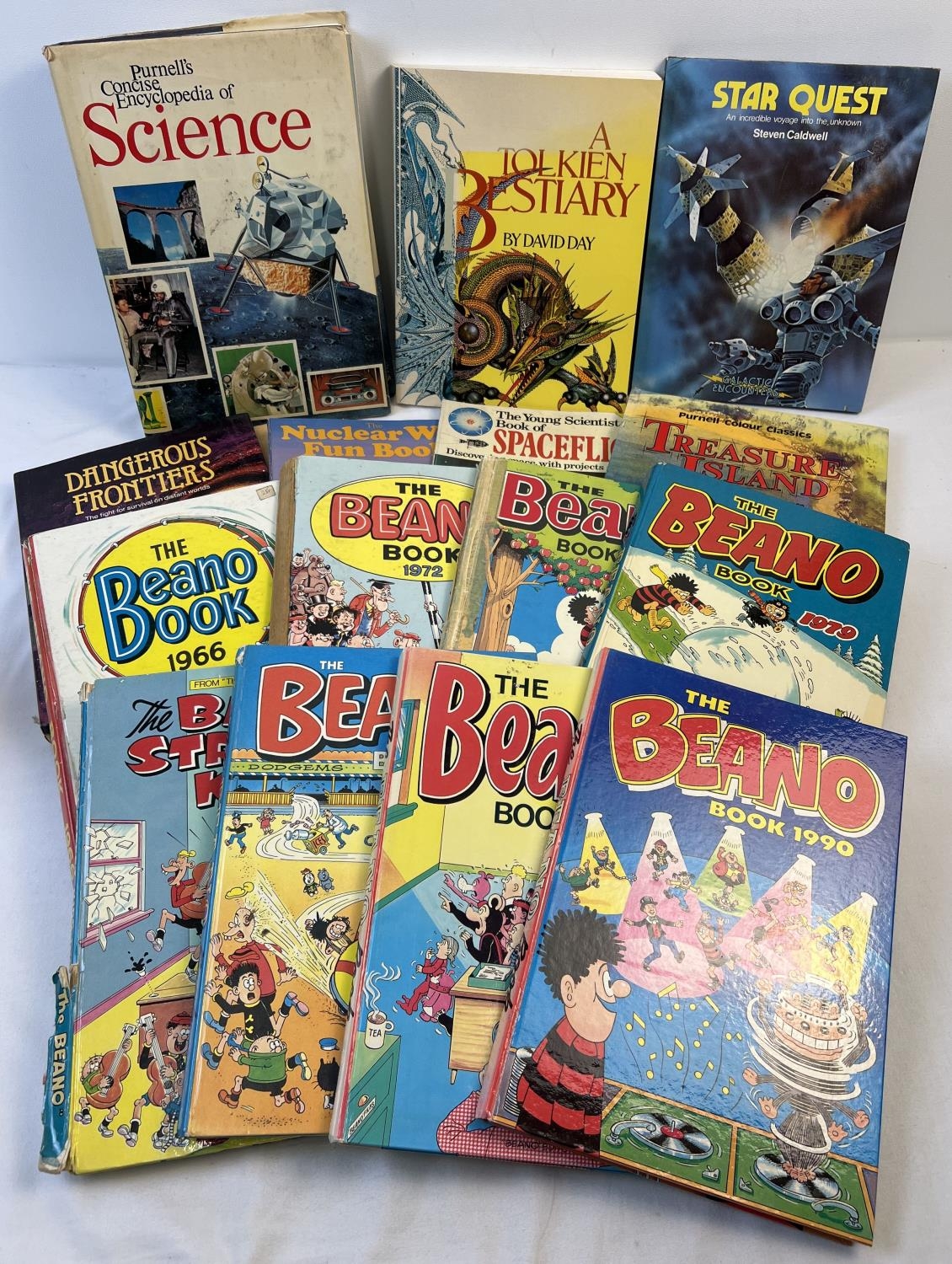 A collection of vintage childrens books and annuals. To include Beano annuals, A Tolkien Bestiary by