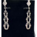 A boxed pair of Art Nouveau style silver drop earrings set with marcasite stones. Total drop approx.