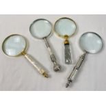 4 large magnifying glasses to include faceted glass handled, brass handled set with pearl, and