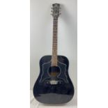 An Eros 906 Raven acoustic guitar in black finish. Model No. 1519. Small split to veneer on base.