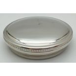 A round pewter lidded trinket box by Tiffany & Co. with beaded decoration to edge of lid. Blue