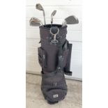 A Wilson black canvas golf bag and cover with contents, to include 6 Wilson 'Dualmetal' golf