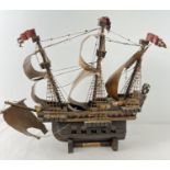 A wooden hand made model of the Santa Maria Spanish Galleon. Hand painted detail to all sails.