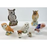A collection of 7 assorted ceramic owl figurines, to include Beswick, Herend and Wade.