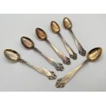 A set of 6 continental silver gilt coffee spoons, each stamped to reverse of handle '830S & NM'.