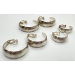 3 pairs of vintage, graduating, white metal, clip on half hoop earrings with floral pattern. Largest