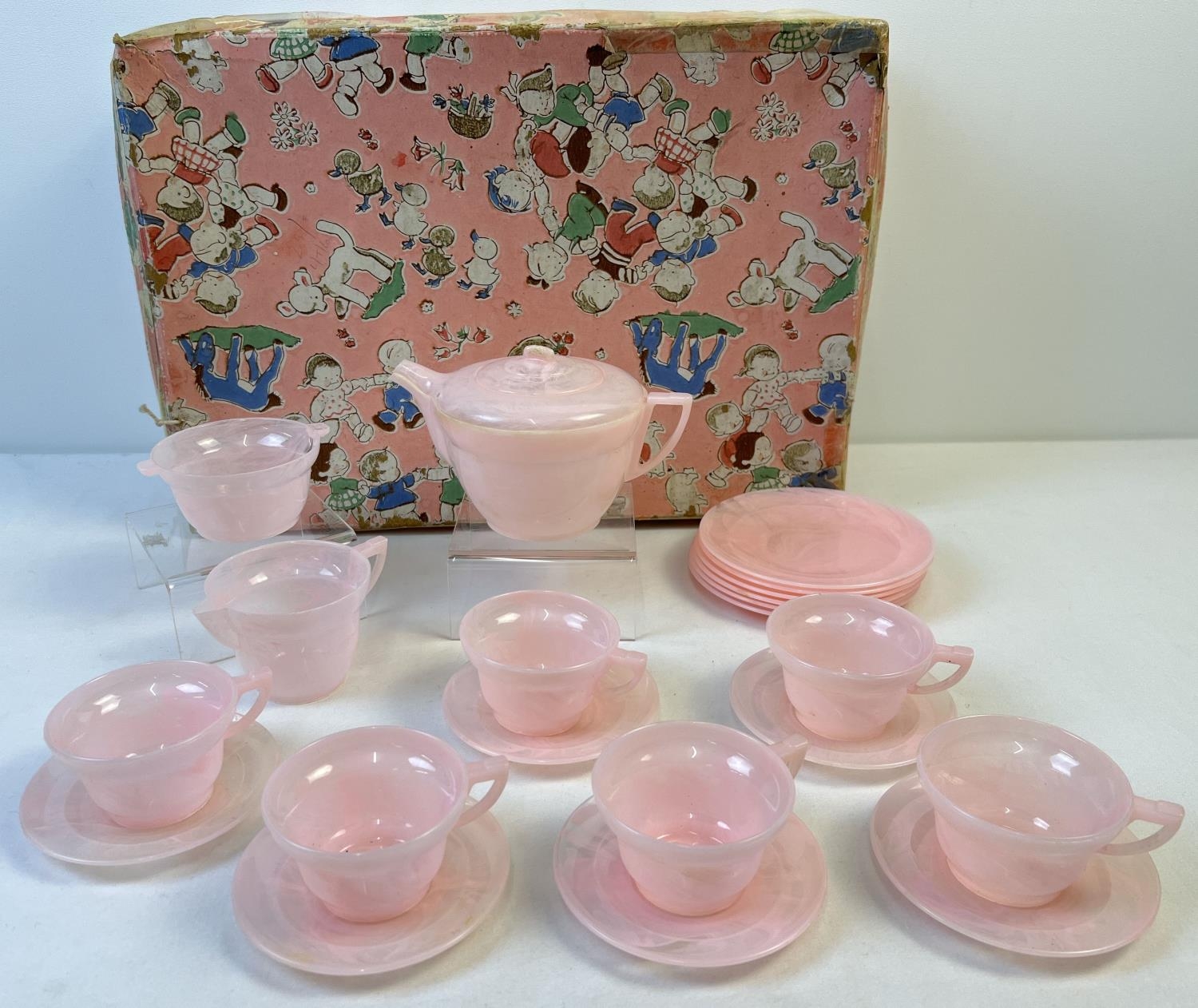 A vintage pale pink marble effect early plastic 21 piece teaset by projects. Comprising: 6 cups