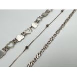 3 vintage silver bracelets. A heart shaped link; a ball and chain; and a Figaro style chain