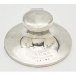 An Art Deco silver inkwell with filled base and inscription to front "S.S.M. W.F. Jay From H.M.M.