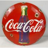 A circular shaped convex enamelled wall sign for Coca Cola. Approx. 29.5cm diameter.
