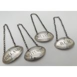 A set of 4 George III silver decanter labels - Brandy, Rum, Hollands & White Wine. Oval shaped