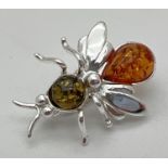 A small 925 silver and amber brooch modelled as a bee, stamped 925 to underside and with makers