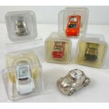 5 boxed and 1 unboxed miniature metal novelty quartz desk clocks modelled as Volkswagen Beetle cars.