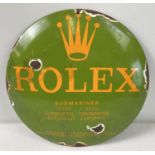 A small circular convex shaped enamelled metal wall advertising sign for Rolex. Approx. 29.5cm
