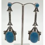 A pair of modern Art Nouveau style silver drop earrings, set with turquoise cabochons & marcasite
