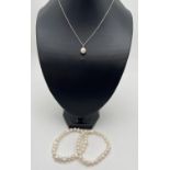2 freshwater white pearl stretch bracelets together with a silver 18" chain with round faux pearl