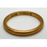 A vintage 22ct gold 2mm wedding band. Full hallmarks to inside of band. Size HÂ½. Total weight