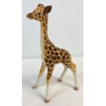 A Beswick ceramic figure of a giraffe, model #853. In gloss finish, approx. 18cm tall. No chips,