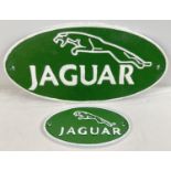 2 oval shaped painted cast iron Jaguar wall plaques, in green and white. Largest approx. 34.5cm