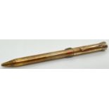 A vintage gold plated on silver Super-Norma Mecan multi coloured propelling pencil. Engine turned