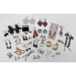 30 pairs of costume jewellery earrings in various designs, in both stud and drop styles. To
