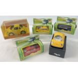 A collection of boxed novelty Volkswagen Beetle shaped collectables. Comprising: 3 diecast lighters,