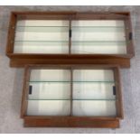 2 vintage wooden framed wall hanging display units with glass sliding doors and interior glass
