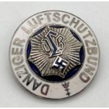 A World War II style Danziger Luftschutzbund circular pin badge with white enamel detail. Possibly