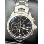 A boxed Link automatic chronograph Tachymeter wristwatch (EBQ8801) by Tag Heuer. Stainless steel