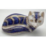 A Royal Crown Derby arctic fox paperweight in royal blue with hand painted gilt detail. Complete