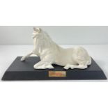 A Royal Doulton "Spirit Of Peace" white porcelain horse figurine on a wooden plinth with name plate.