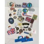 A collection of assorted car badges, stickers and cloth patches. To include AA car badge, car
