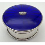 An Art Deco silver jewellery/trinket box with royal blue guilloche lid with central crown shaped