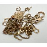 A small quantity of mixed 9ct gold jewellery suitable for scrap. To include broken chains and single