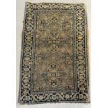 A small Persian rug/prayer mat, colours faded. Approx. 82cm x 53cm.
