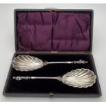 A pair of decorative William Hutton & sons silver plated serving spoons in original period case with