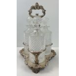 A vintage silver plated triple decanter stand complete with 3 cut glass decanters with cut diamond