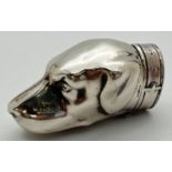 A novelty silver vesta case modelled as a dogs head, with striking panel to underside. Hinged lid in