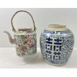 2 pieces of oriental ceramics. A teapot with rattan handle, decorated with pheasant, peach, raddish,