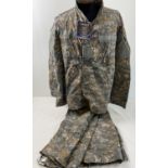 A New with tags US Army combat uniform jacket and trousers in UCP Delta pattern (Universal Combat