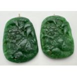 2 jade pendants with Foo dog carved detail and gold coloured metal hanging bales. Each approx. 6cm x