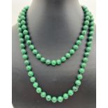 A 35" beaded necklace made from 8mm diameter malachite beads.