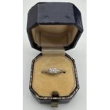 An Art Deco design 18ct gold and diamond ring with platinum setting (cut through). Central round cut