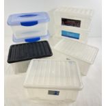 8 small lidded plastic tubs - approx. 8 litres. 3 with hinged lids, 3 with snap on lids and 2 with