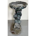 A modern 2 sectional garden bird bath with pedestal base modelled as a tree trunk with animals. With