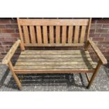 A modern slatted wood garden bench, approx. 121cm long.