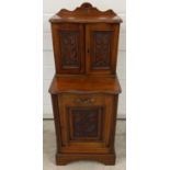 A Victorian mahogany purdonium coal scuttle cabinet with carved floral design to doors. Pull-down