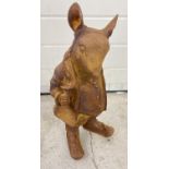 A large rusted cast iron figure of a rat in a suit. Approx. 43cm tall.