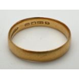 A 22ct gold plain 4mm wedding band. Weight approx. 2.8g. Ring size NÂ½.