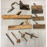 A collection of vintage wooden block, molding planes and woodworking tools. To include large block